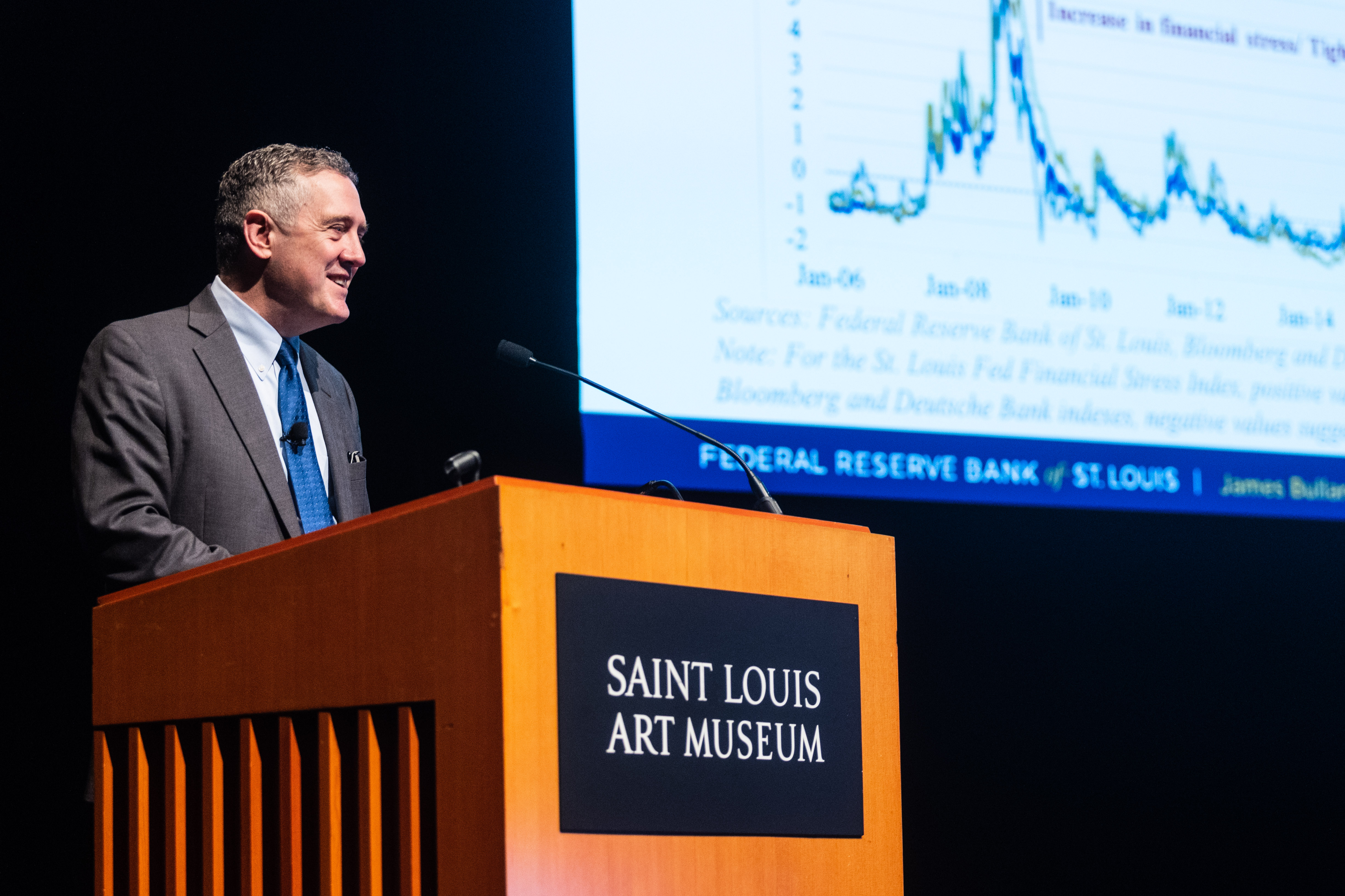 James Bullard addresses the audience from the stage at the Saint Louis Art Museum.
