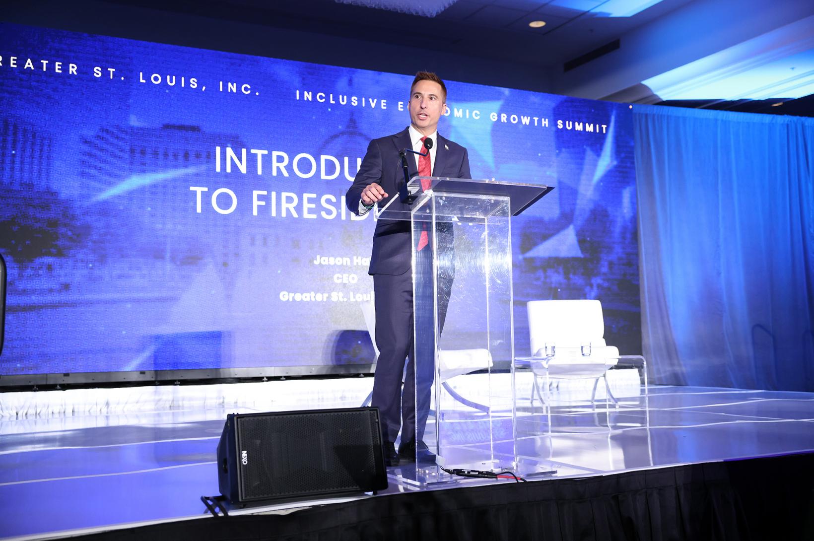 CEO Jason Hall speaks on stage at the Inclusive Economic Growth Summit.