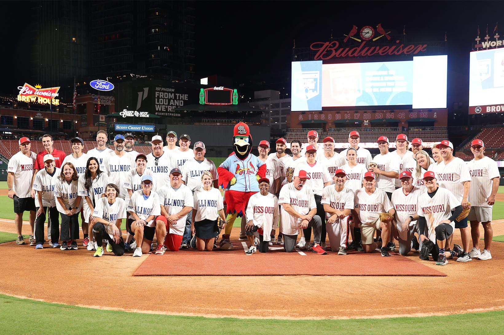2025 Bi-State Softball Showdown - Group Photo 2025 Bi-State Softball Showdown players gather on the field at Busch Stadium.